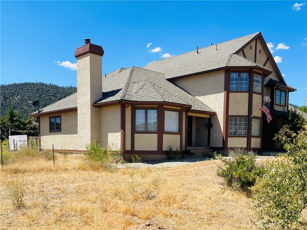 10500 Steinhoff Road Frazier Park, CA 93225 - Photo 2 of 75 a front view of a house with a yard covered in snow