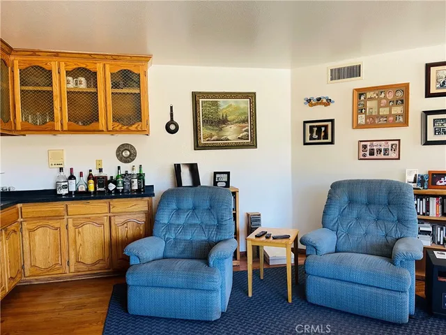 a bedroom with a bed and a large mirror