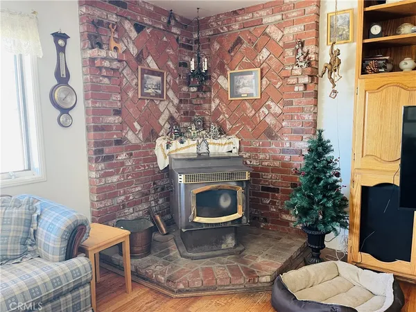 a living room with flat screen tv and a fireplace