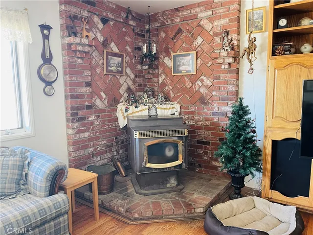 a living room with flat screen tv and a fireplace