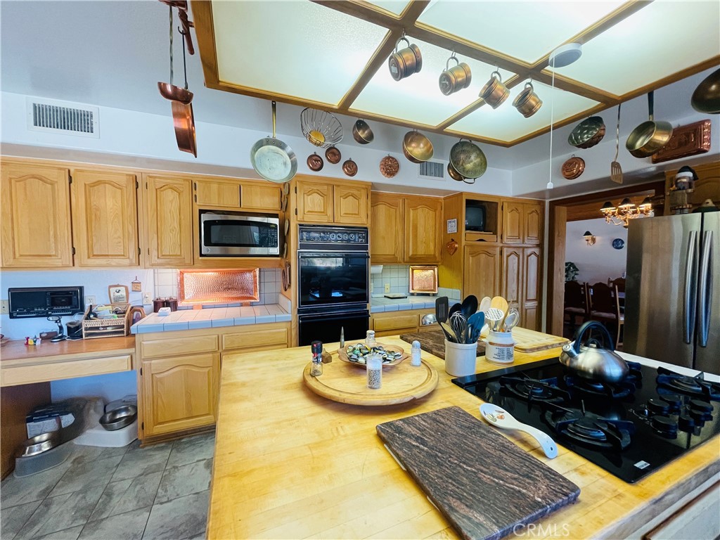 10500 Steinhoff Road Frazier Park, CA 93225 - Photo 35 of 75 a kitchen with lots of counter top space and furniture