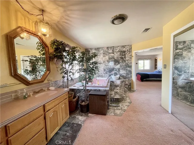 a view of a livingroom with a ceiling fan and window