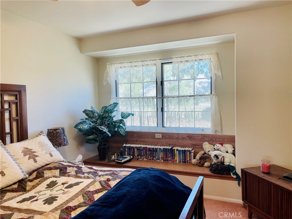 10500 Steinhoff Road Frazier Park, CA 93225 - Photo 49 of 75 a bed sitting in a bedroom next to a window