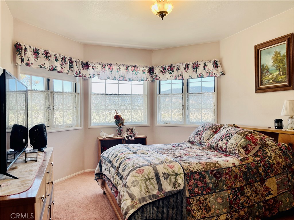 10500 Steinhoff Road Frazier Park, CA 93225 - Photo 52 of 75 a bedroom with a bed and a window