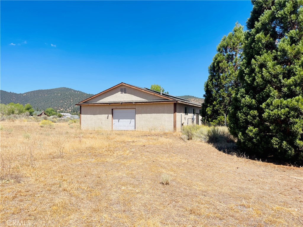 10500 Steinhoff Road Frazier Park, CA 93225 - Photo 58 of 75 a front view of a house with a yard and mountain view