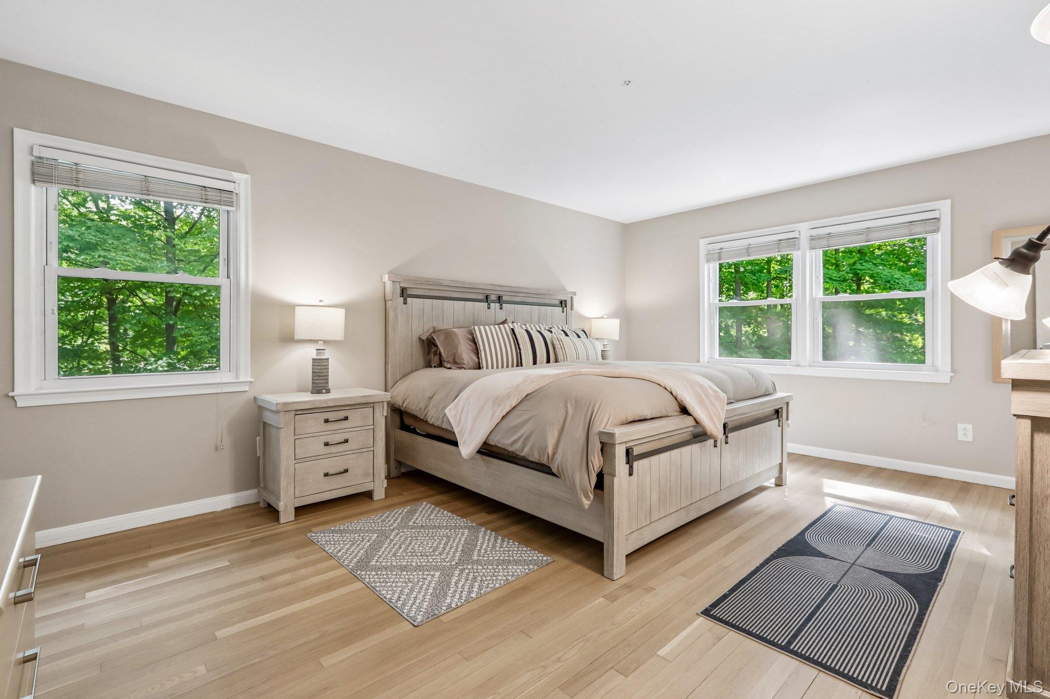 62 Mohegan Road Larchmont, NY 10538 - Photo 30 of 46 a bedroom with a large bed and a window