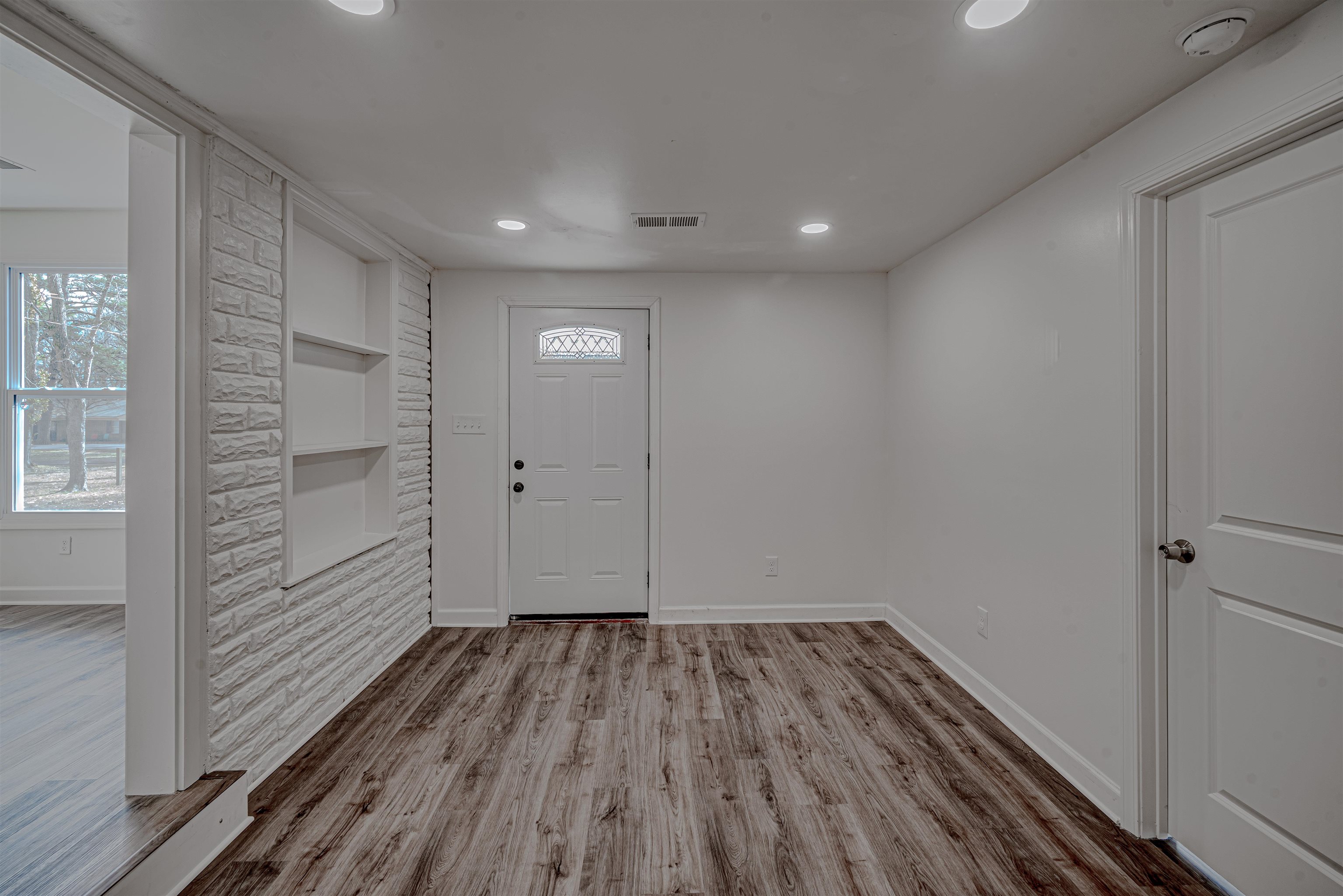 7414 3rd Road Bartlett, TN 38135 - Photo 4 of 25 Smooth ceilings and NEW Luxury Vinyl Plank flooring throughout entire home!