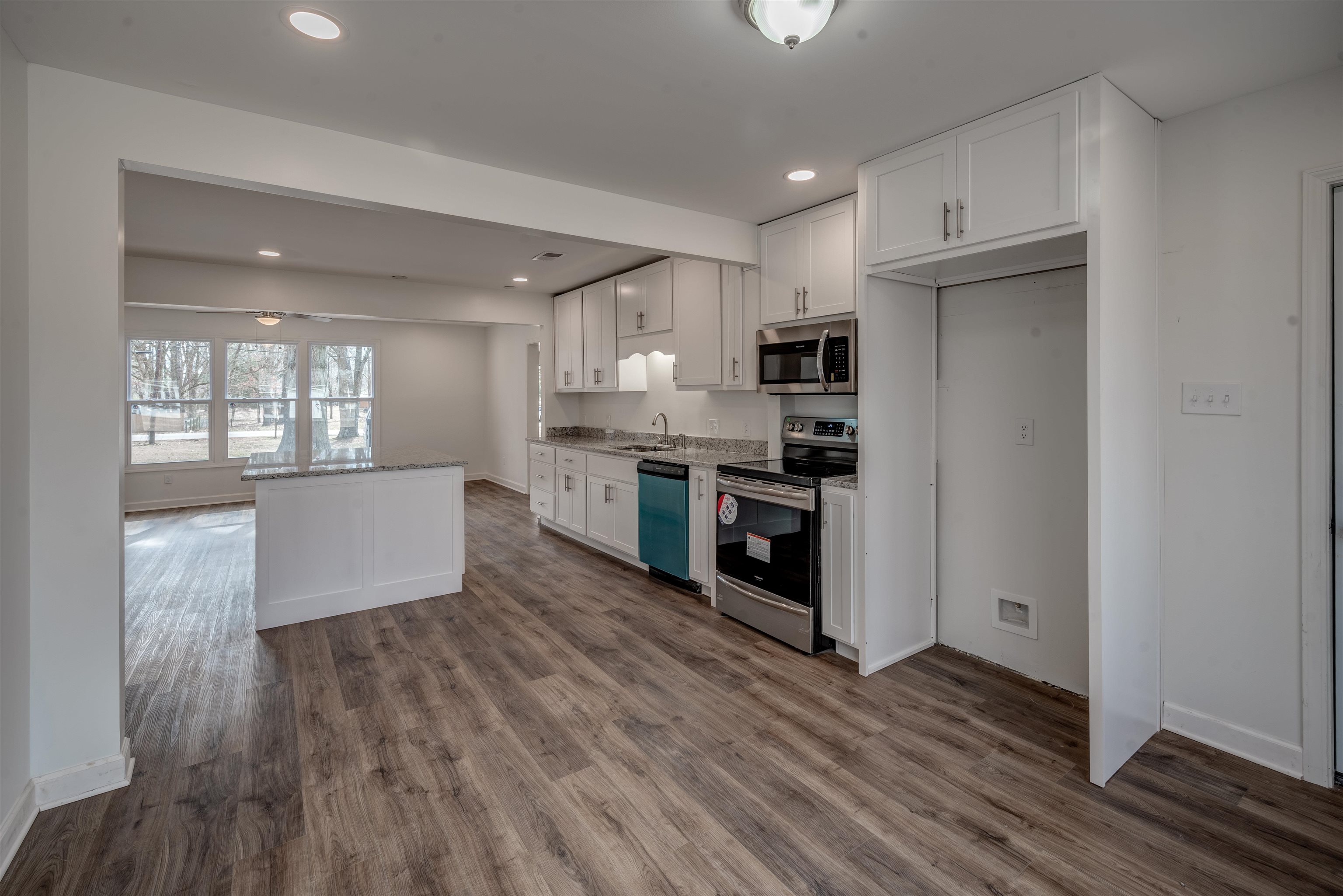 7414 3rd Road Bartlett, TN 38135 - Photo 8 of 25 Frigidaire appliances including glass top range oven, dishwasher and built-in microwave.