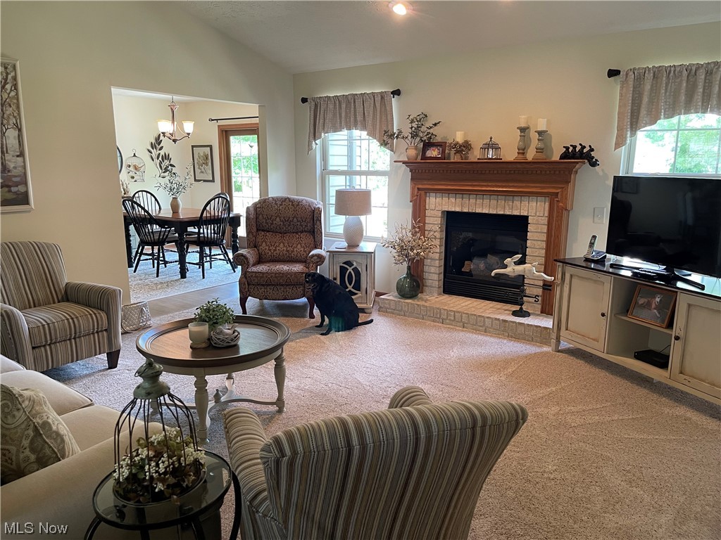 39212 Chestnut Ridge Road Elyria, OH 44035 - Photo 6 of 27 Walk in to beautiful living room with vaulted ceiling, newer carpet & gas fireplace!