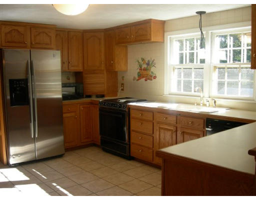 89 Ortins Road Hamilton, MA 01982 - Photo 3 of 8 a kitchen with a sink stove and refrigerator