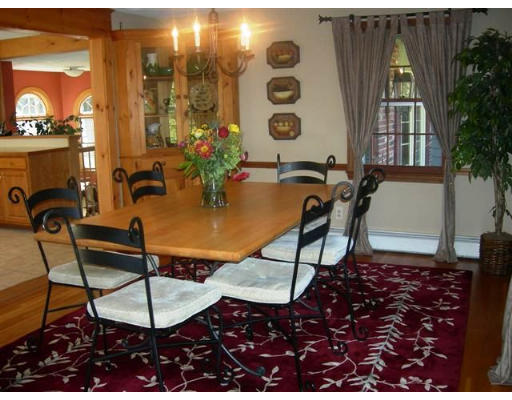 89 Ortins Road Hamilton, MA 01982 - Photo 4 of 8 a view of a dining room with furniture and chandelier fan