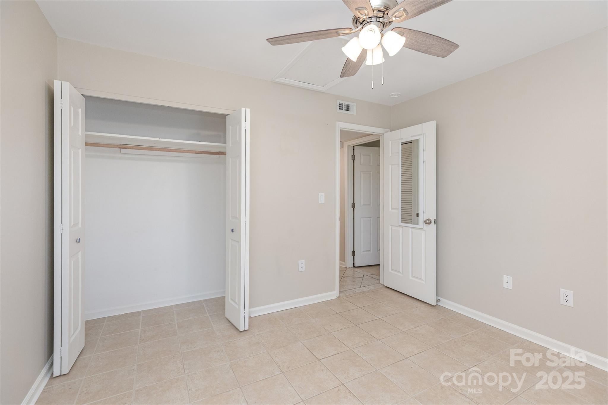 1778 Hunters Trail Rock Hill, SC 29732 - Photo 11 of 24 an empty room with chandelier fan and windows