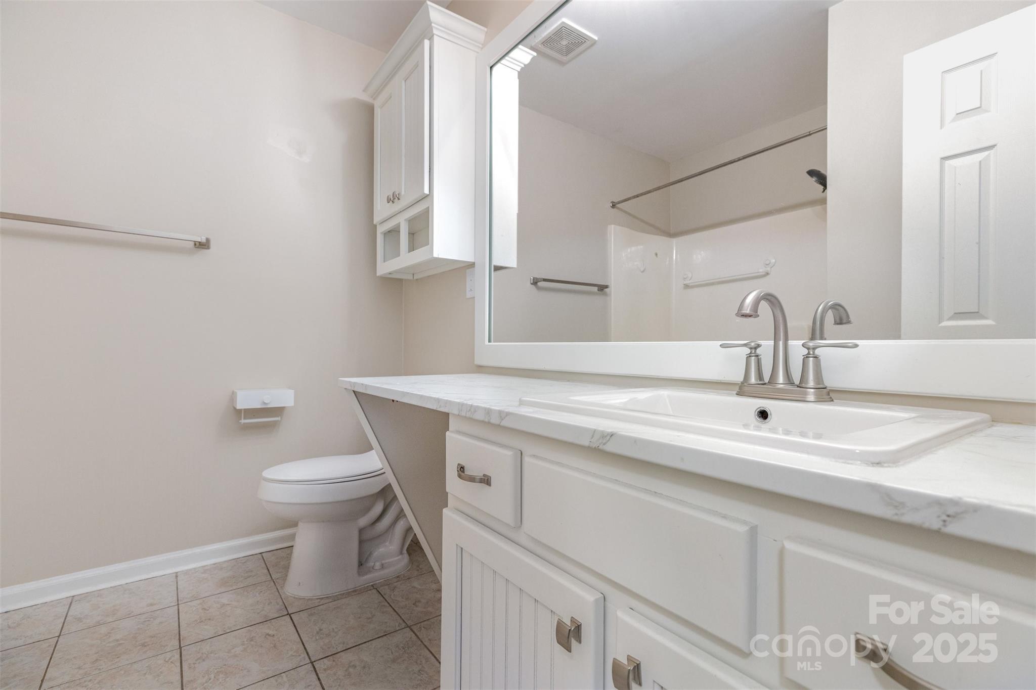 1778 Hunters Trail Rock Hill, SC 29732 - Photo 14 of 24 a bathroom with a sink a toilet and mirror