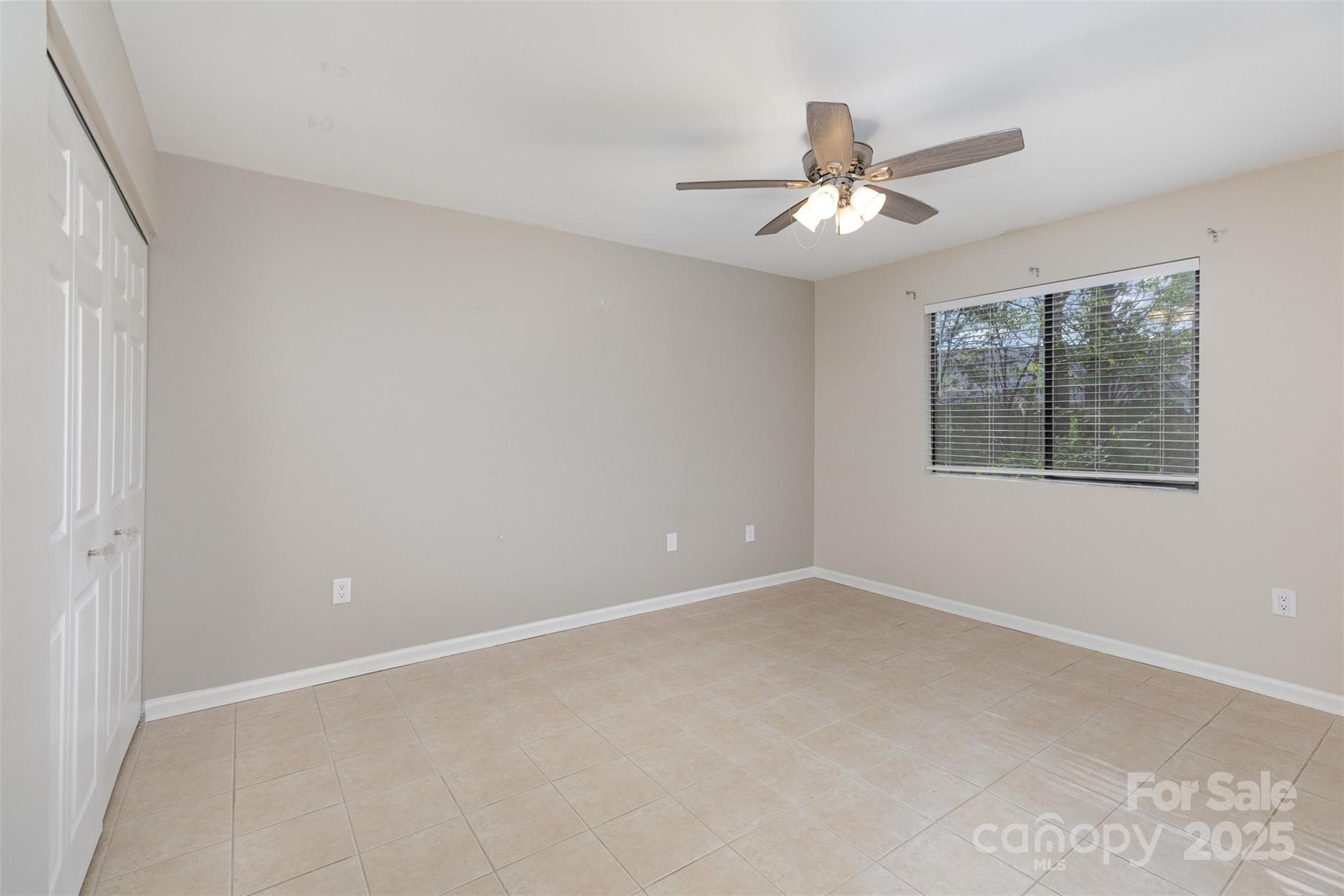 1778 Hunters Trail Rock Hill, SC 29732 - Photo 17 of 24 an empty room with a window and a fan