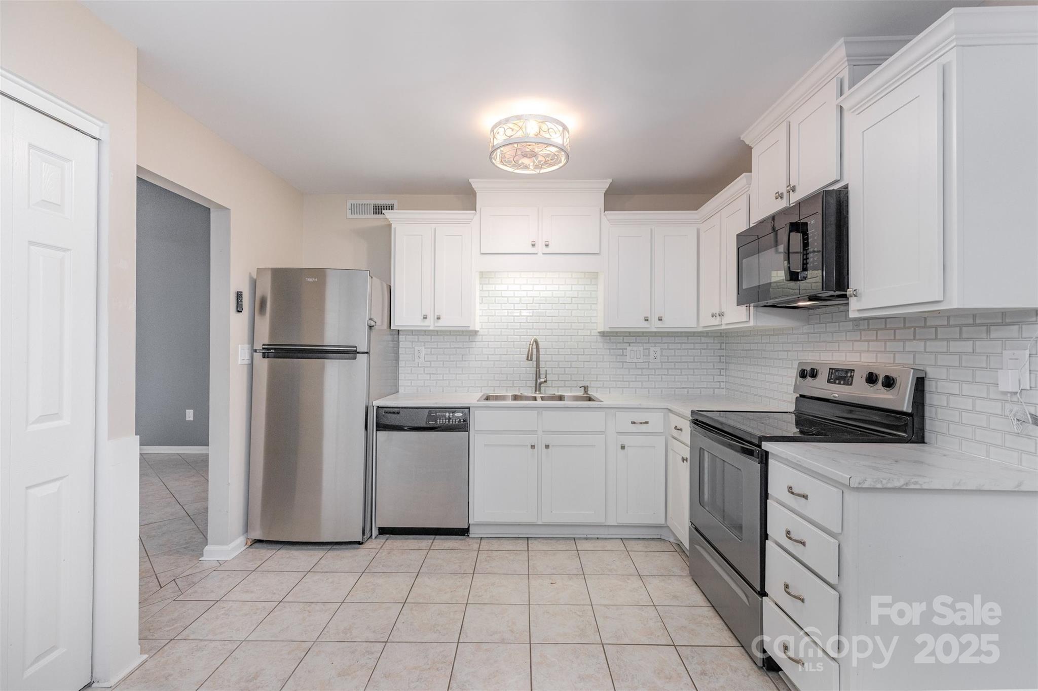 1778 Hunters Trail Rock Hill, SC 29732 - Photo 2 of 24 a kitchen with stainless steel appliances granite countertop a refrigerator sink and stove