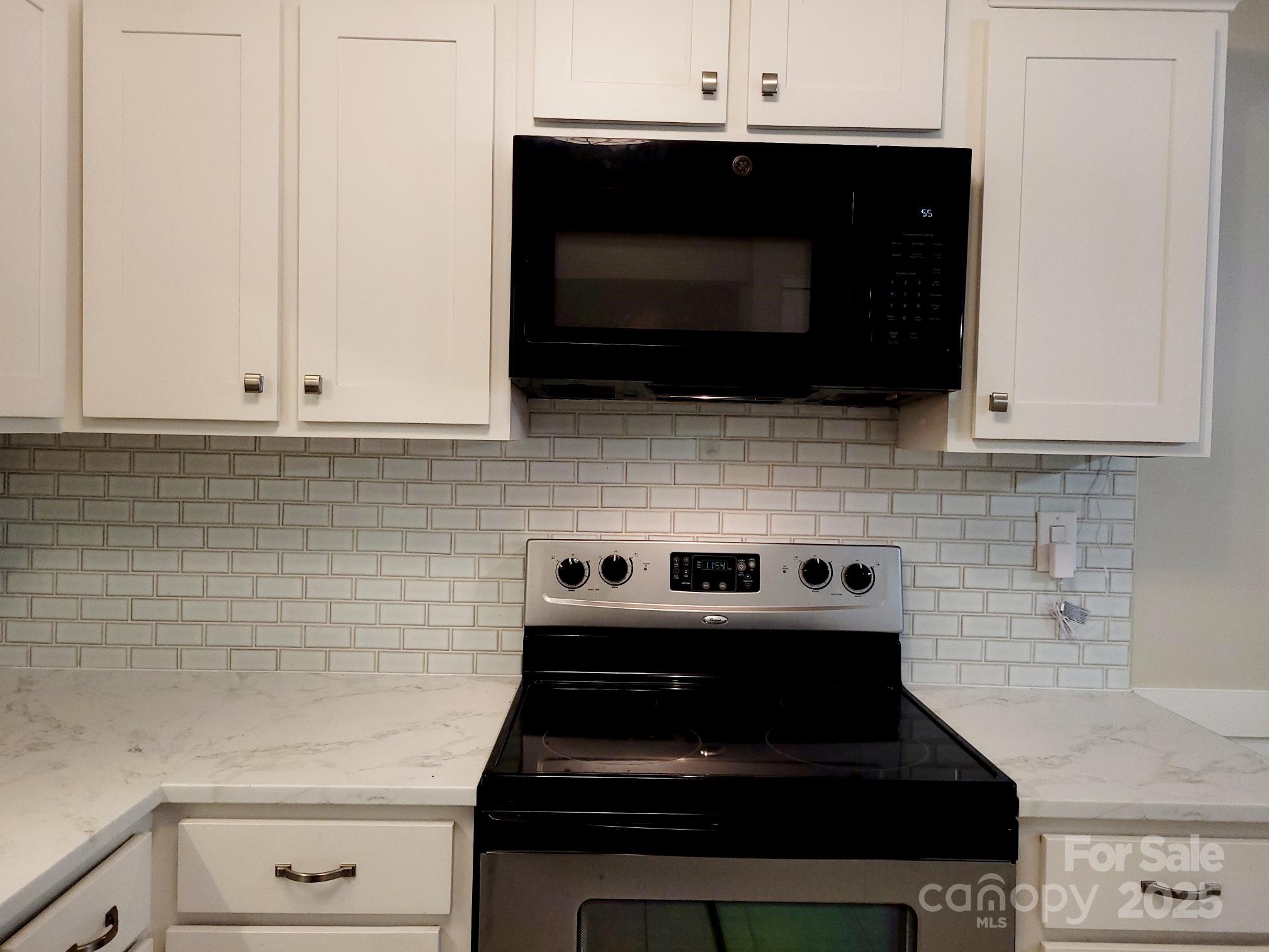 1778 Hunters Trail Rock Hill, SC 29732 - Photo 4 of 24 a kitchen with a stove and a microwave
