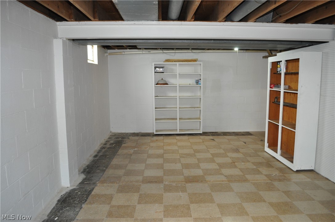 8262 Navarre Road Southwest Massillon, OH 44646 - Photo 22 of 26 storage cabinets convey in basement