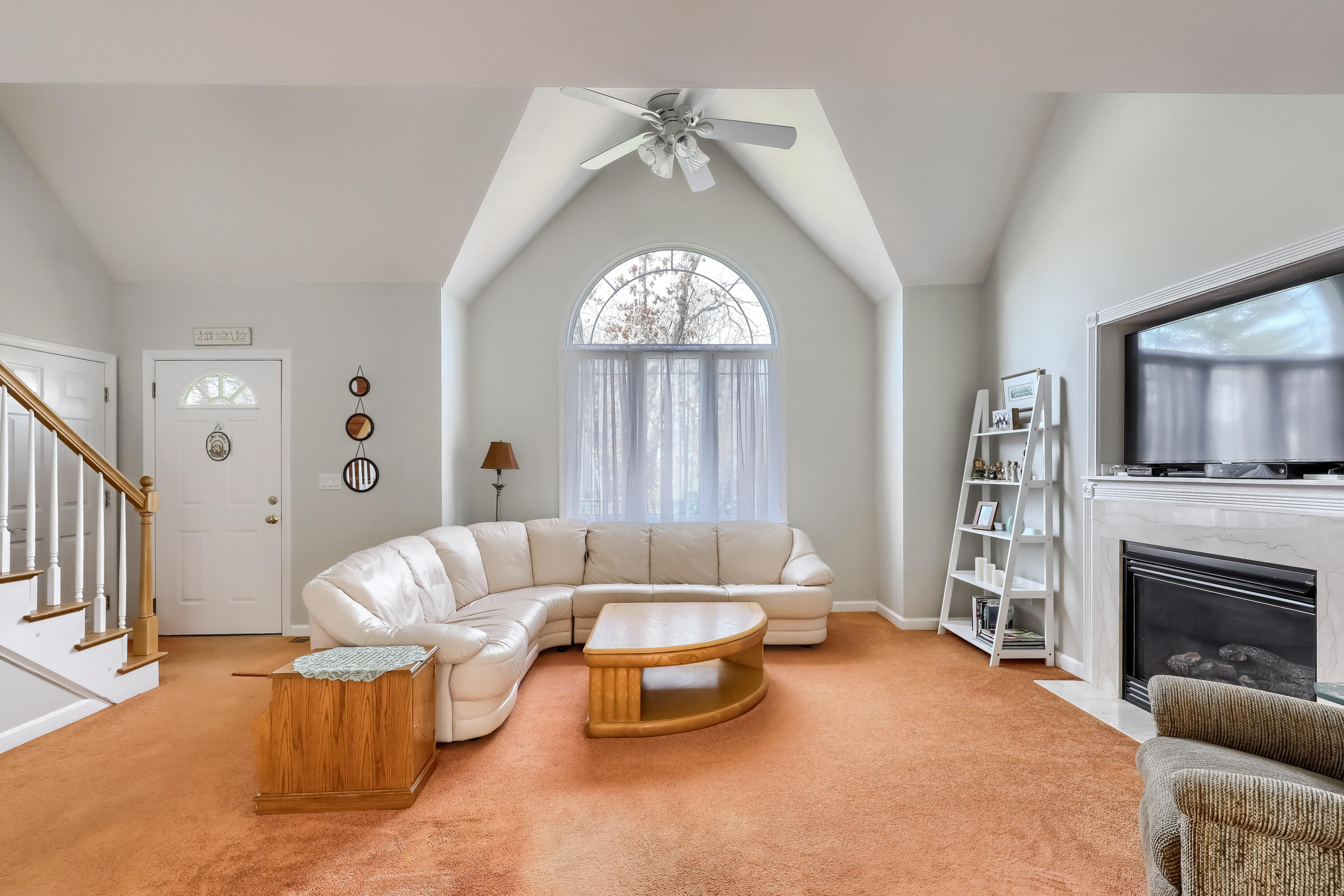 57 Fox Hill Road Mashpee, MA 02649 - Photo 3 of 23 a living room with furniture a fireplace and a flat screen tv