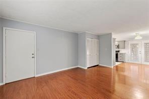 1822 North Rock Springs Road Northeast, Unit 7 Atlanta, GA 30324 - Photo 6 of 21 a view of empty room with wooden floor