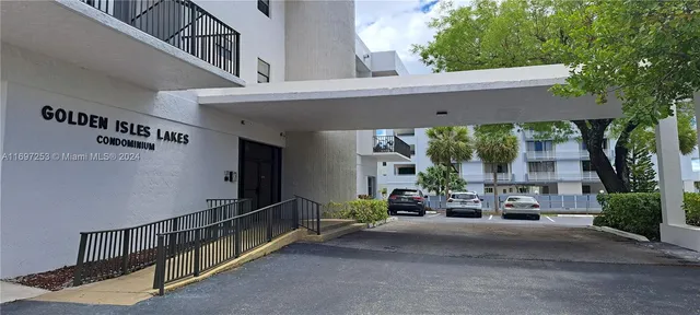 a view of a patio with table and chairs