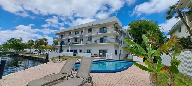 a view of a swimming pool with a patio