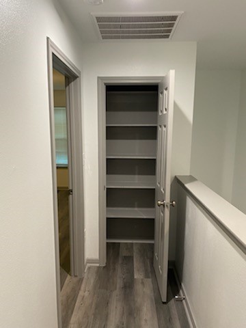 8105 Corinth Street, Unit B Houston, TX 77051 - Photo 15 of 26 a view of walk in closet with empty racks