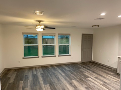 8105 Corinth Street, Unit B Houston, TX 77051 - Photo 17 of 26 a view of an empty room with wooden floor and a window