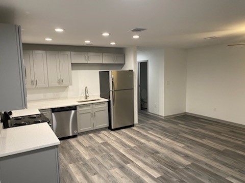 8105 Corinth Street, Unit B Houston, TX 77051 - Photo 24 of 26 a kitchen with a refrigerator a sink and dishwasher