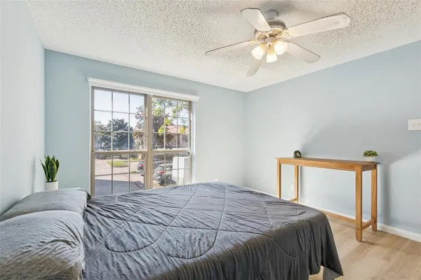 a bedroom with a large bed and a large window