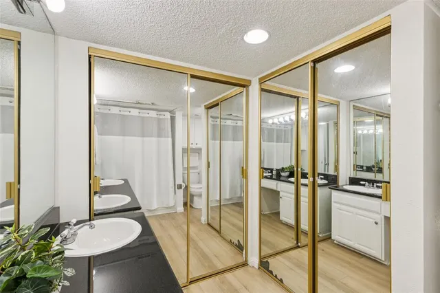 a bathroom with a tub and shower