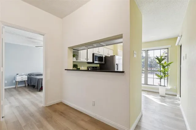 a view of a living room with furniture and a flat screen tv