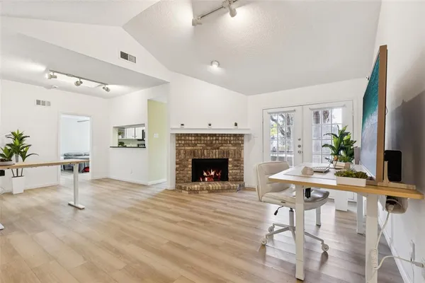 a living room with furniture and a fireplace