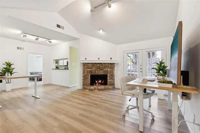 a living room with furniture and a fireplace