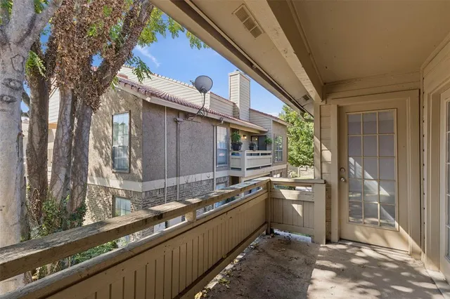 a kitchen with stainless steel appliances granite countertop a sink and a stove