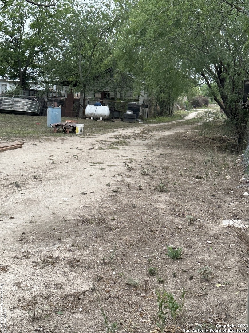 429 Wingate Street La Pryor, TX 78872 - Photo 14 of 14 a view of backyard with trees