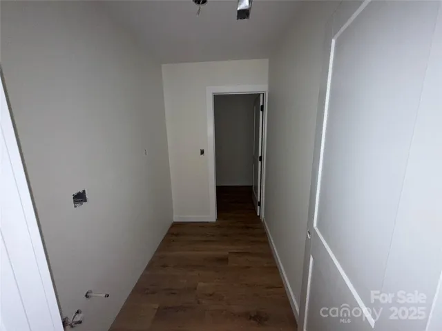 a view of a hallway with the wooden floor