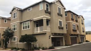 a front view of a building with many windows