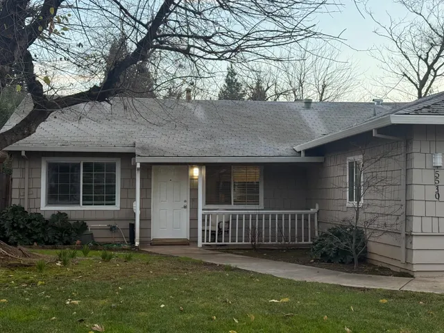 front view of a house with a yard