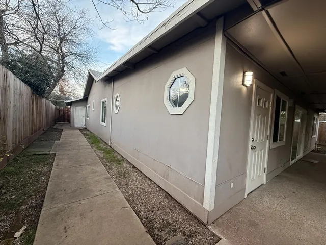 a view of a room with wooden floor and stairs