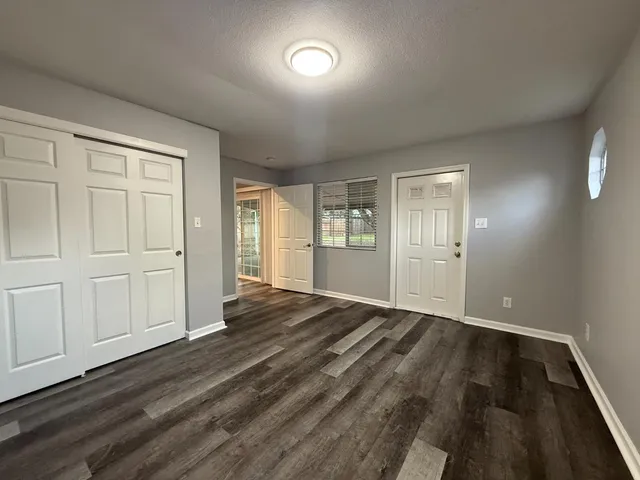 a view of an empty room with a window