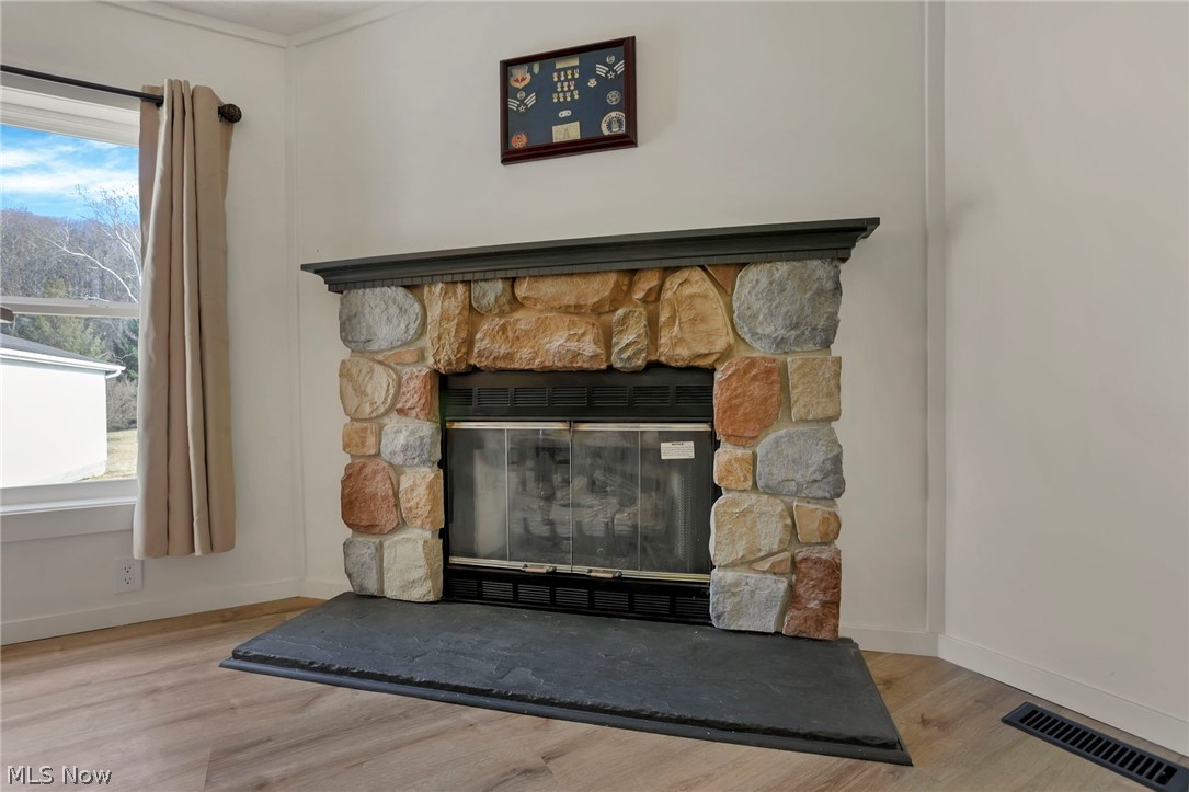 3750 Cannelville Road Roseville, OH 43777 - Photo 7 of 33 Detailed view of a fireplace and wood finished floors