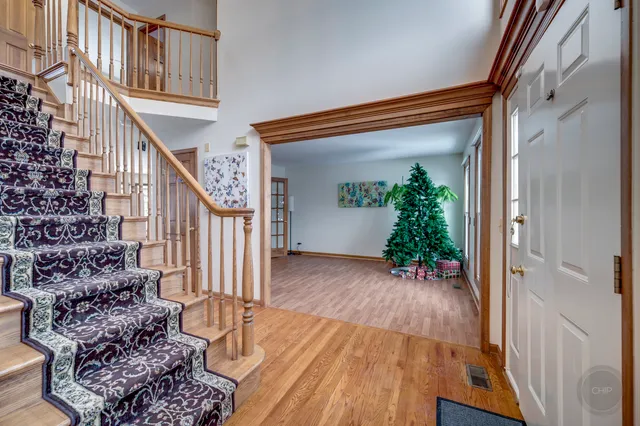 a view of entryway with wooden floor