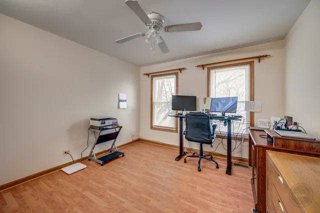 a workspace with furniture and a window