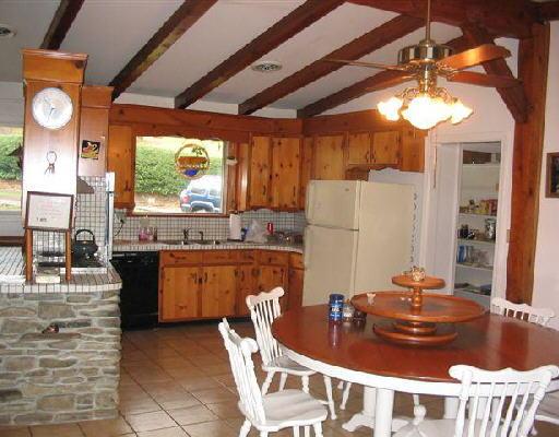 3672 Sterling Road Roanoke, VA 24014 - Photo 3 of 5 a kitchen with a stove a sink and a refrigerator