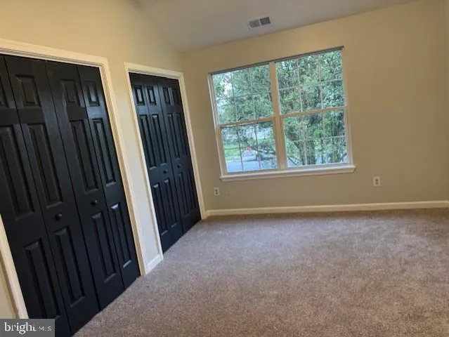 a bathroom with a shower a toilet and a bathtub