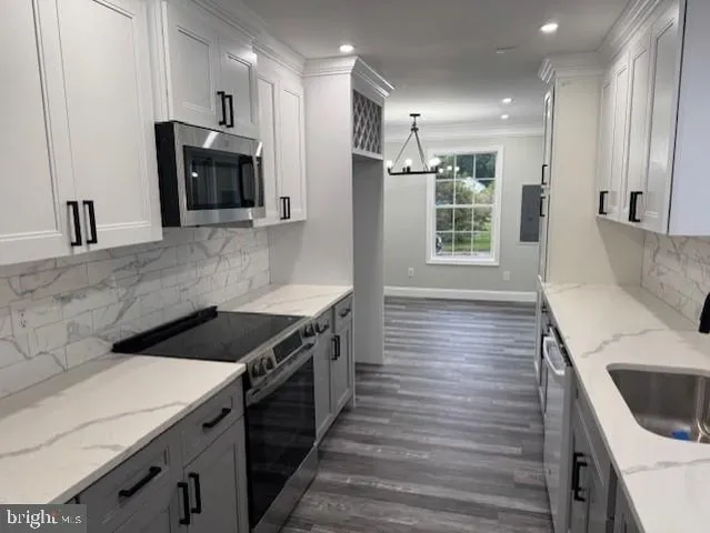 a kitchen with a stove and a refrigerator
