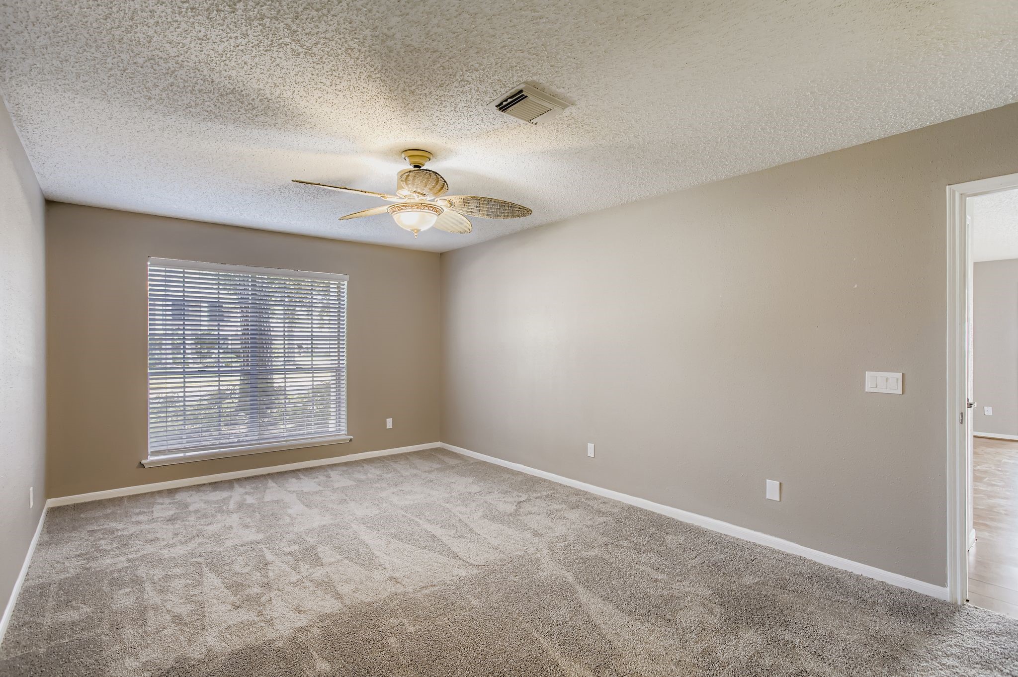 7519 Sunlight Lane Houston, TX 77095 - Photo 15 of 27 a view of an empty room with a window