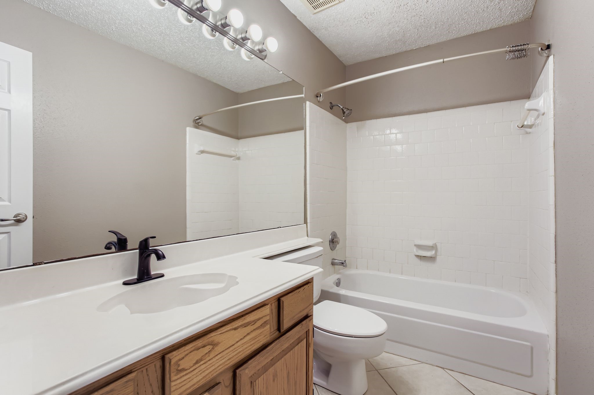 7519 Sunlight Lane Houston, TX 77095 - Photo 22 of 27 a bathroom with a sink a toilet a mirror and shower