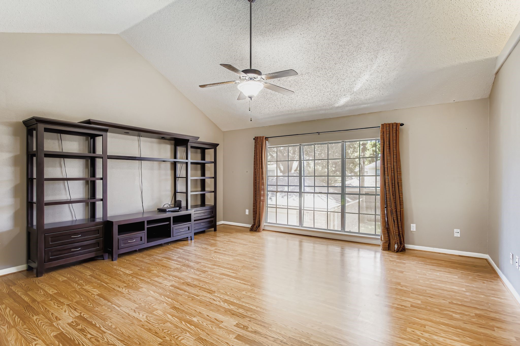 7519 Sunlight Lane Houston, TX 77095 - Photo 24 of 27 a view of an empty room with a window and a kitchen