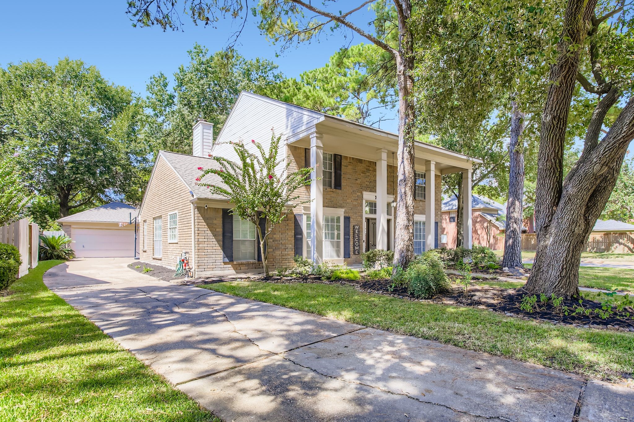 7519 Sunlight Lane Houston, TX 77095 - Photo 3 of 27 a front view of house with yard and green space